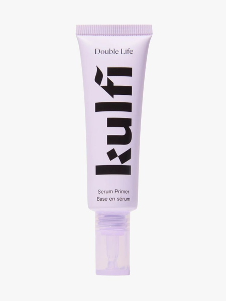 Kulfi Double Life Serum Primer in branded tube component on a light gray background